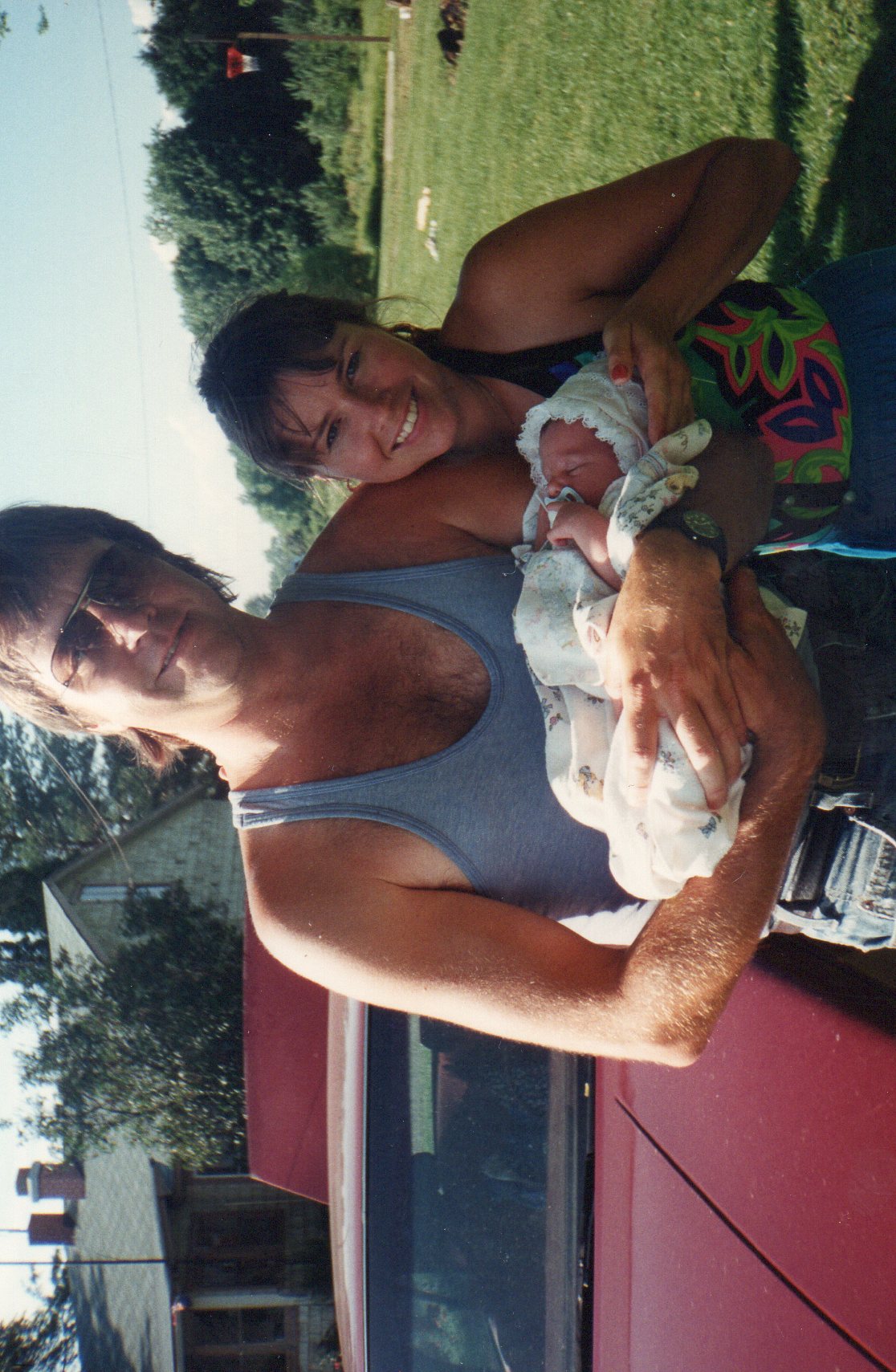 Larry holding baby Kim with his sister Val, 1994