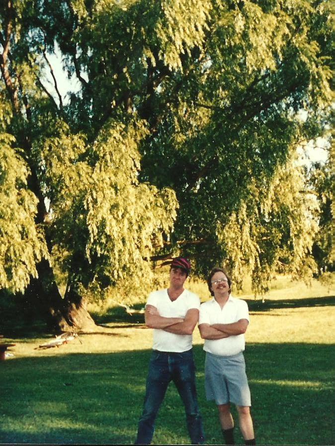 Larry with his brother Mark under a willow tree, early 1990s