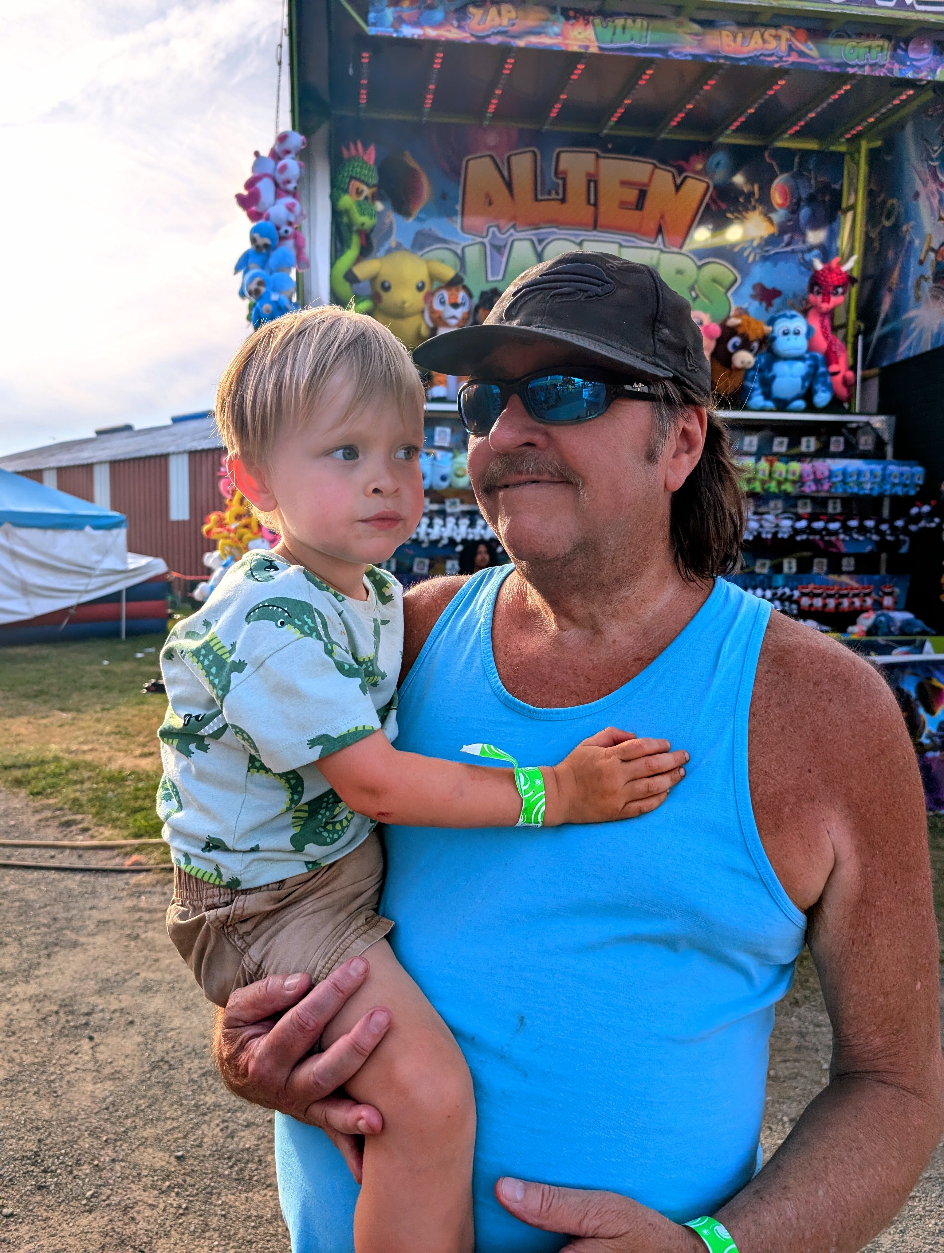 Larry holding his grandson Nova at the Chautauqua County Fair, 2025