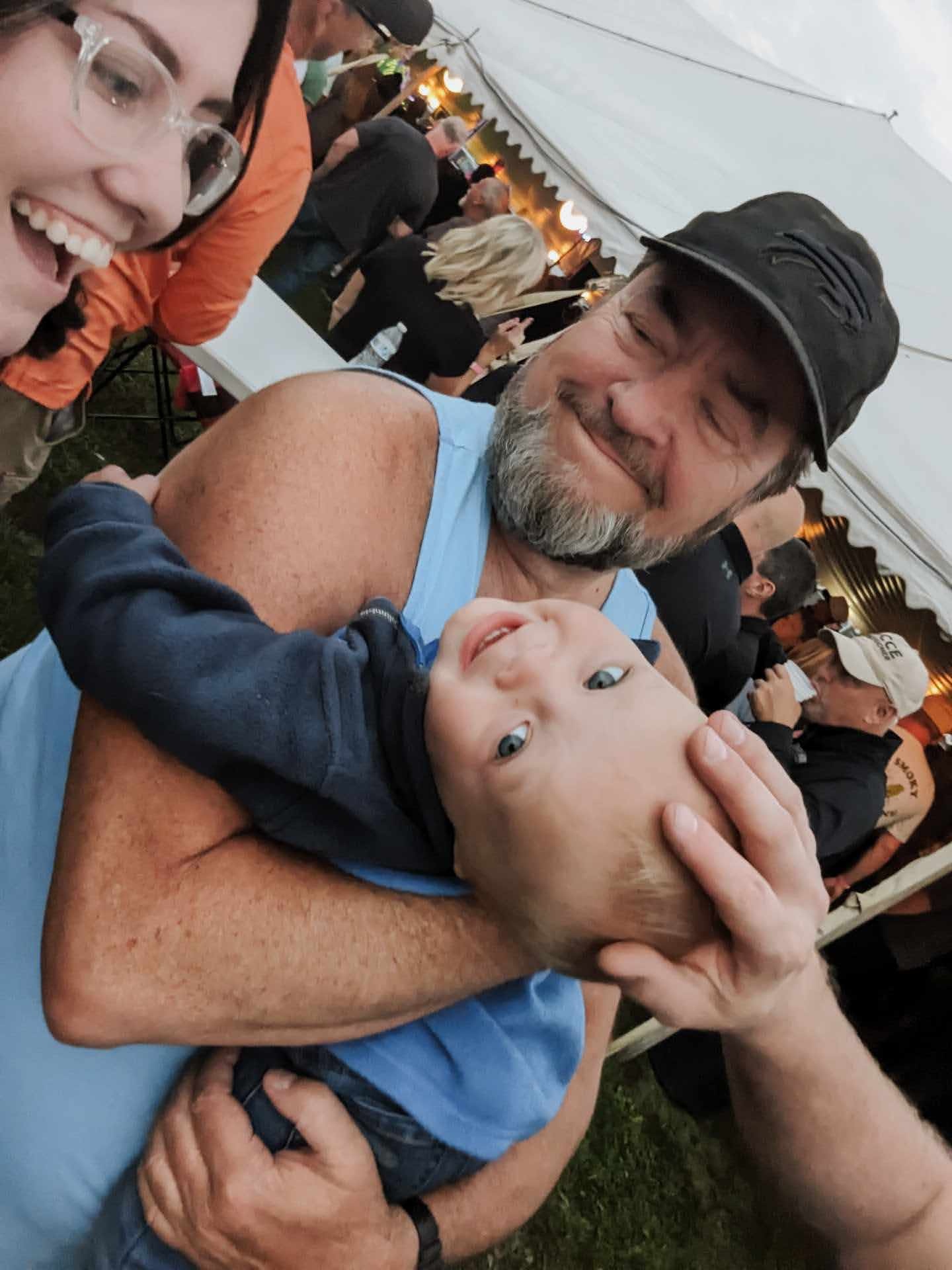 Larry holding little Nova at a Nerds Gone Wild concert during Scranton Volunteer Fire Co Community Days, Hamburg NY, August 2023