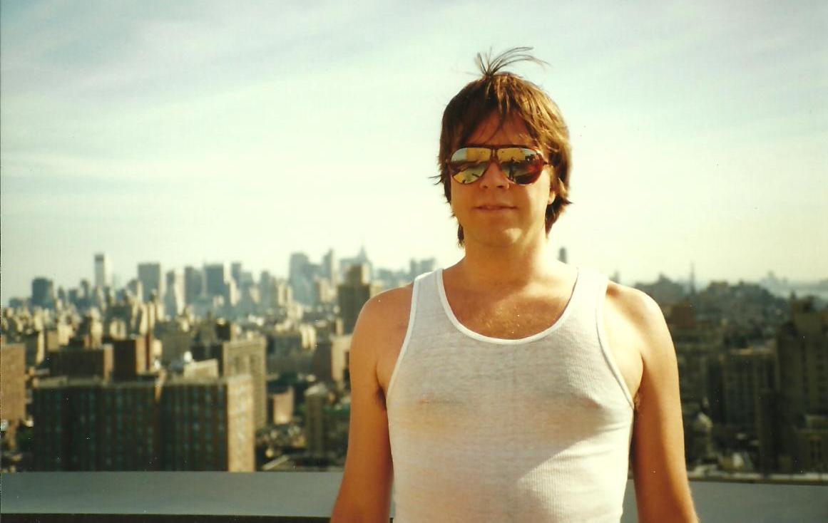 Larry on a rooftop in New York City at a parade with his sister Pam, 1991