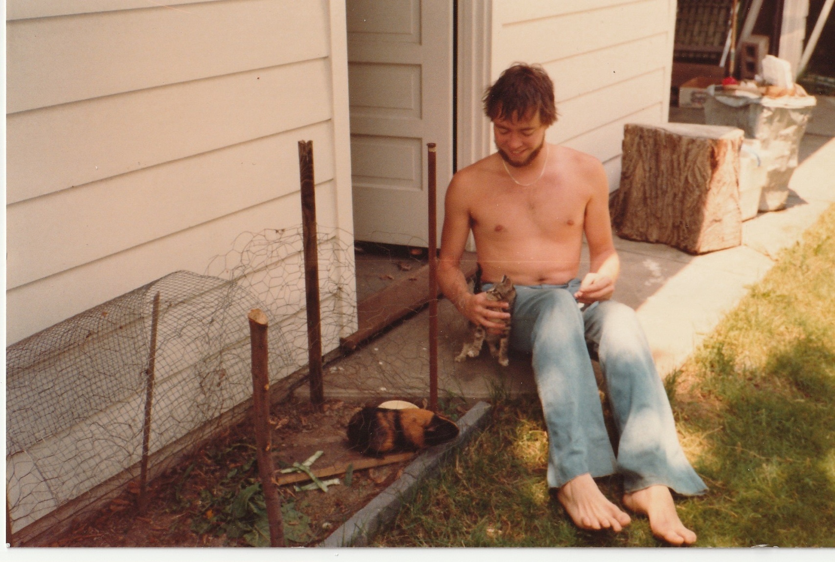 Larry with a cat and a guinea pig at the family home in South Huxley, Cheektowaga, 1979