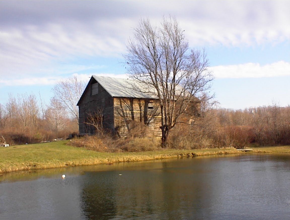 The old wooden barn at the Westfield farm, by the pond, in late autumn