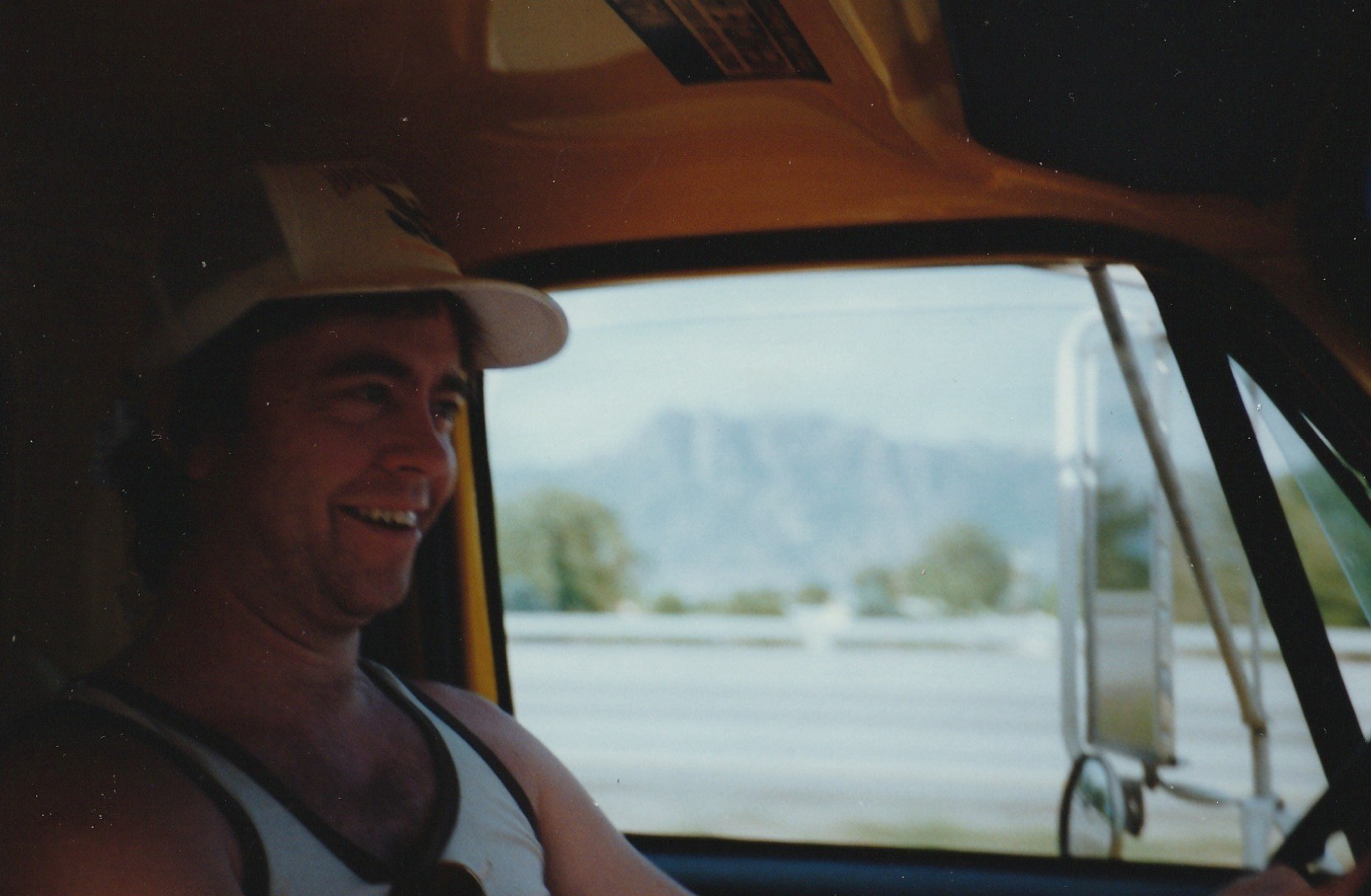 Larry driving a moving van across the country for his sister Pam
