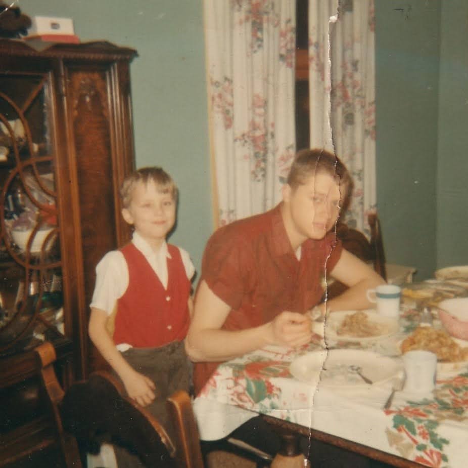 Mike eating dinner with younger brother Mark