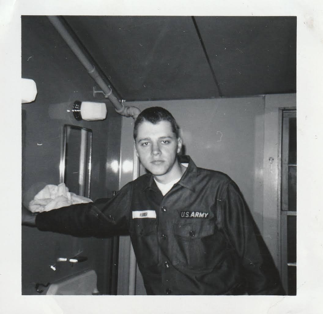 Mike in fatigues at the barracks, HILBURGER name patch visible