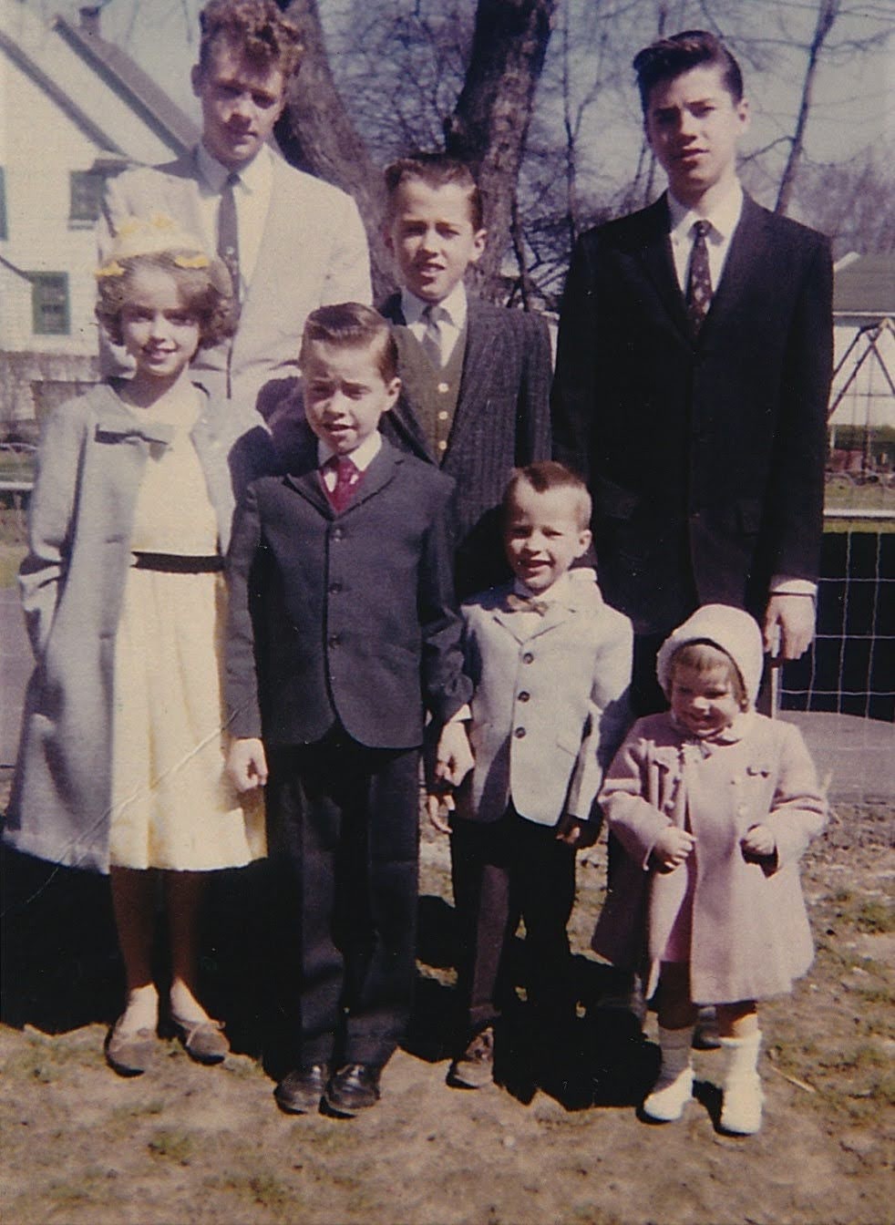 The siblings dressed for Easter, color portrait