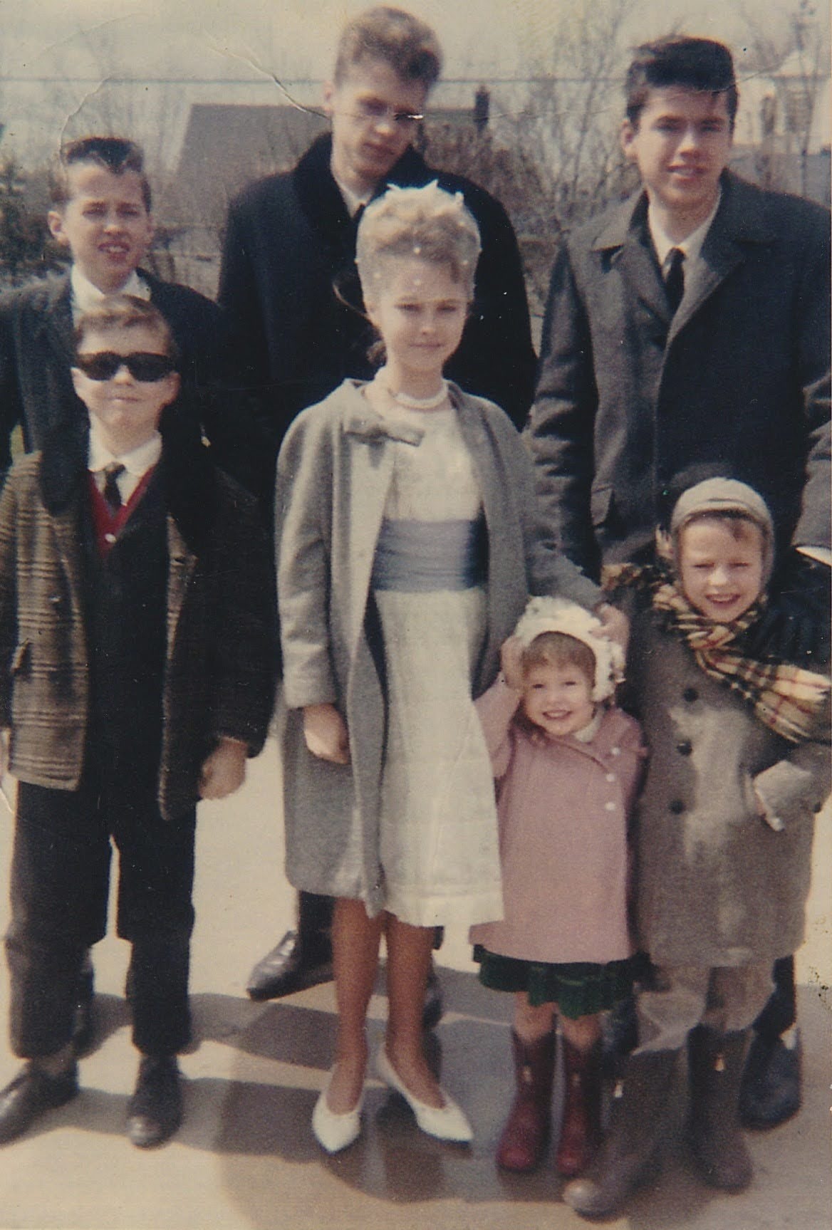 The siblings dressed for Easter, mid-1960s, with Larry in suit and sunglasses (a.k.a. Mr. Shades on Sunday)